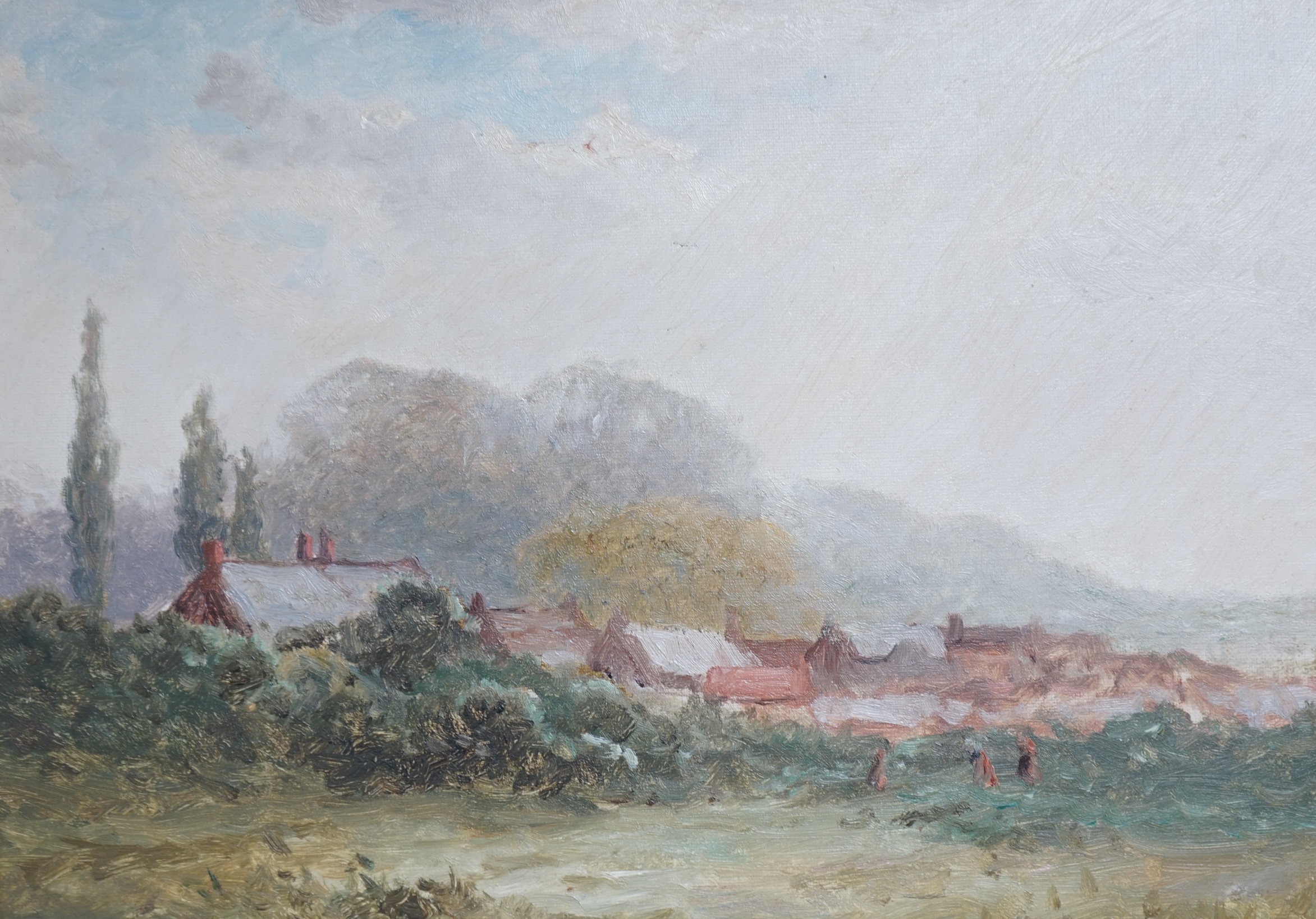 Late 19th century, English school, oil on canvas, View of a village across fields, unsigned, 26 x 36cm, gilt framed. Condition - fair to good